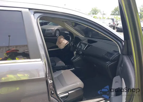 2015 Honda Cr-V Touring z USA, uszkodzony, nr VIN 5J6RM4H97FL125455